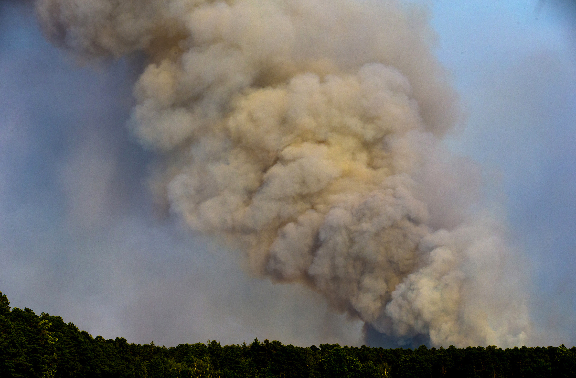 PHOTO: Smoke billows from a wildfire in Wharton State Park near Hammonton, N.J., June 20, 2022.