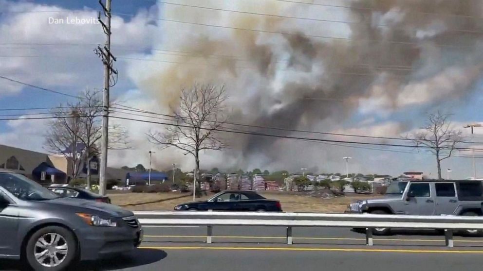 PHOTO: Firefighters in Ocean County, New Jersey work to contain a massive forest fire that burned 170 acres, damaged nearby structures and seriously injured a firefighter on March 14, 2021.