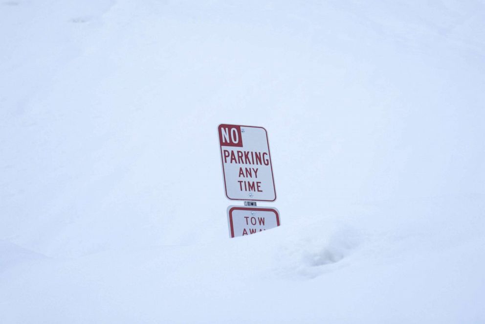 PHOTO: A parking sign is buried in snow after a winter storm in Mt Baldy, Calif., on March 2, 2023.
