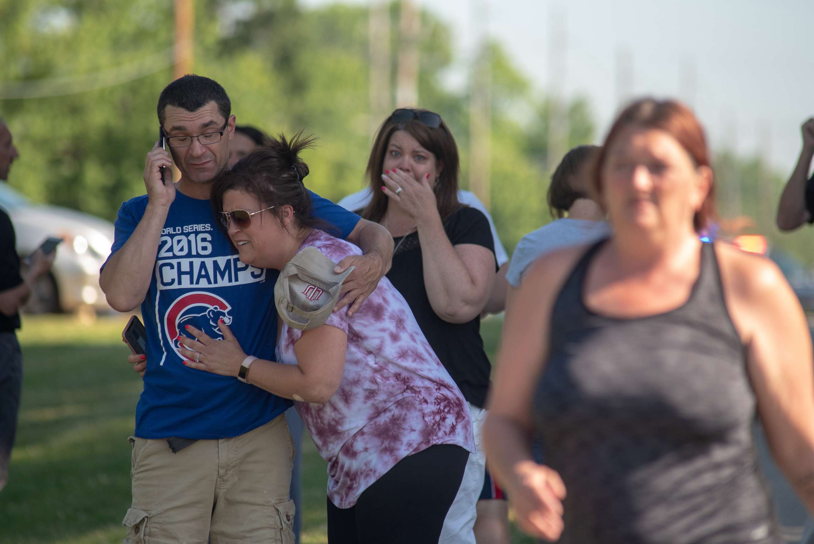 PHOTO: Parents comfort each other as they wait outside Noblesville West Middle School after a shooting on May 25, 2018 in Noblesville, Ind.