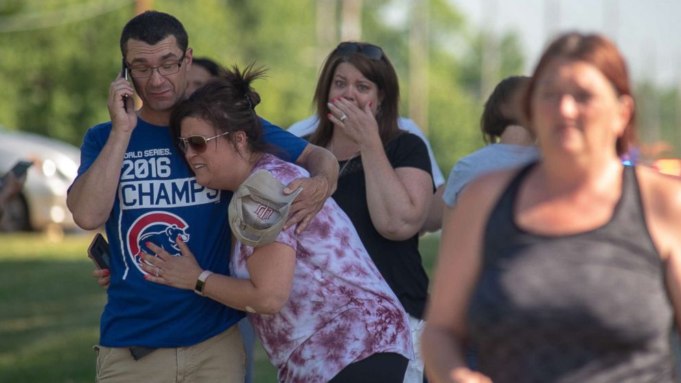 PHOTO: Parents comfort each other as they wait outside Noblesville West Middle School after a shooting on May 25, 2018 in Noblesville, Ind.