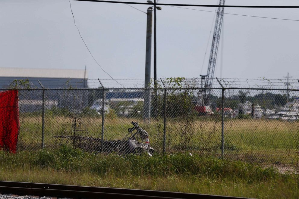 PHOTO: The charred wreckage of a private plane is seen in a field near the Industrial Canal and New Orleans Lakefront airport, in New Orleans,  Aug. 16, 2019. 