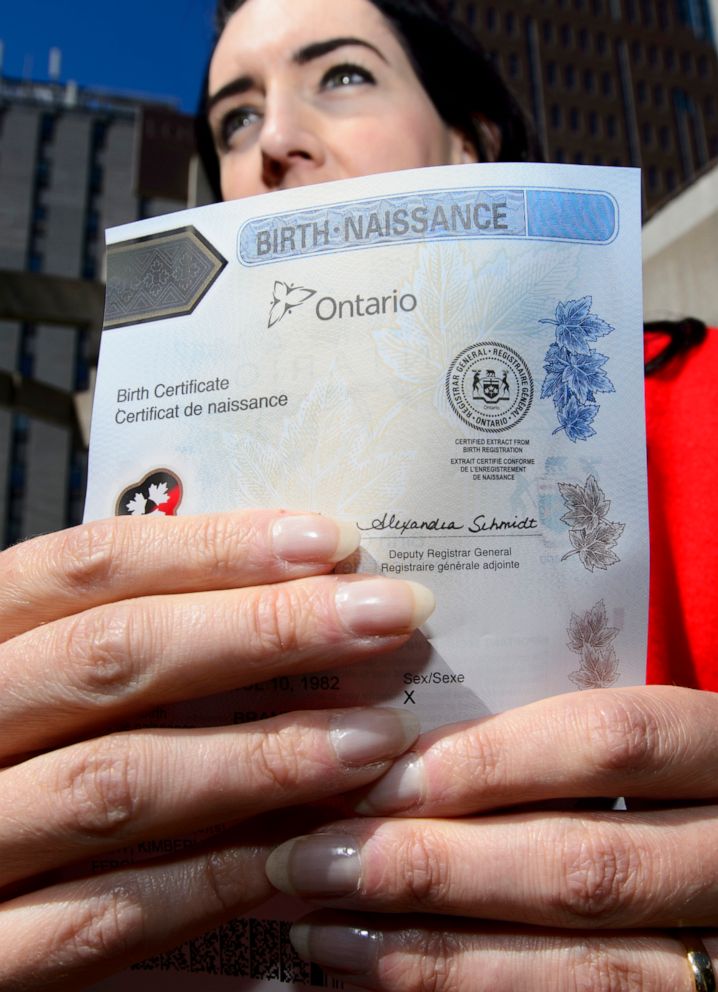 PHOTO: In this May 7, 2018, file photo, Joshua M. Ferguson who received Ontario's first non-binary birth certificate talks to the press at the Human Rights Monument in Ottawa, Ontario.