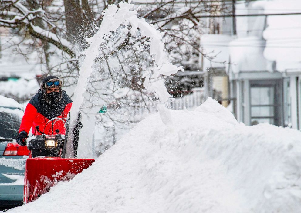 PHOTO: A person uses a snowblower to clear snow from the road during winter storm Orlena in Lawrence, Mass., on Feb. 2, 2021.