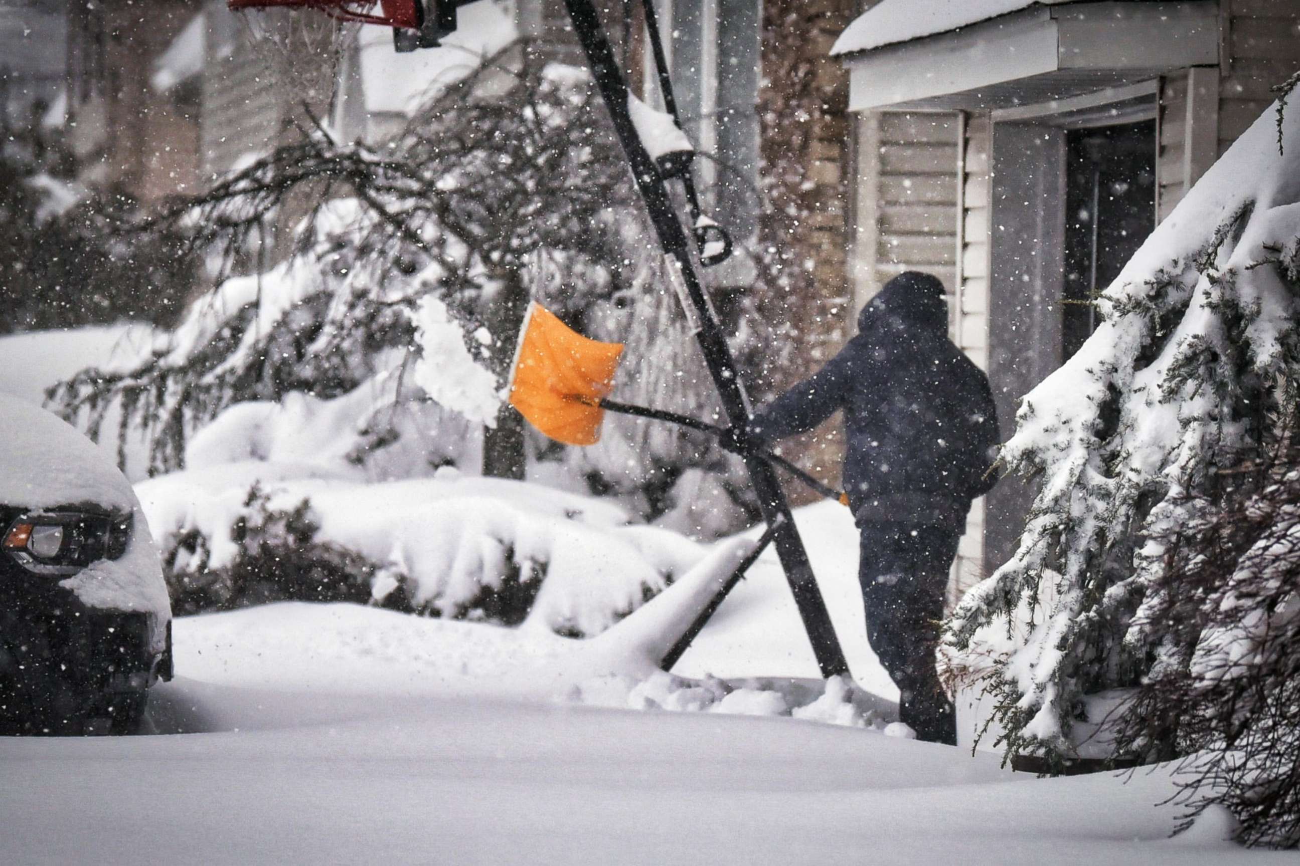 PHOTO: A man removes snow from his driveway in Fair Lawn, N.J., Feb. 4, 2021.