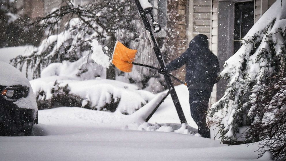 PHOTO: A man removes snow from his driveway in Fair Lawn, N.J., Feb. 4, 2021.