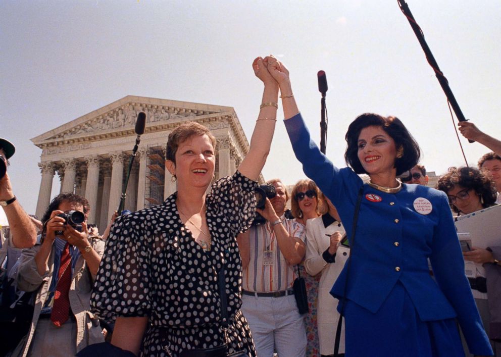 PHOTO: In this Wednesday, April 26, 1989 file photo, Norma McCorvey, Jane Roe in the 1973 court case, left, and her attorney Gloria Allred hold hands as they leave the Supreme Court building in Washington.