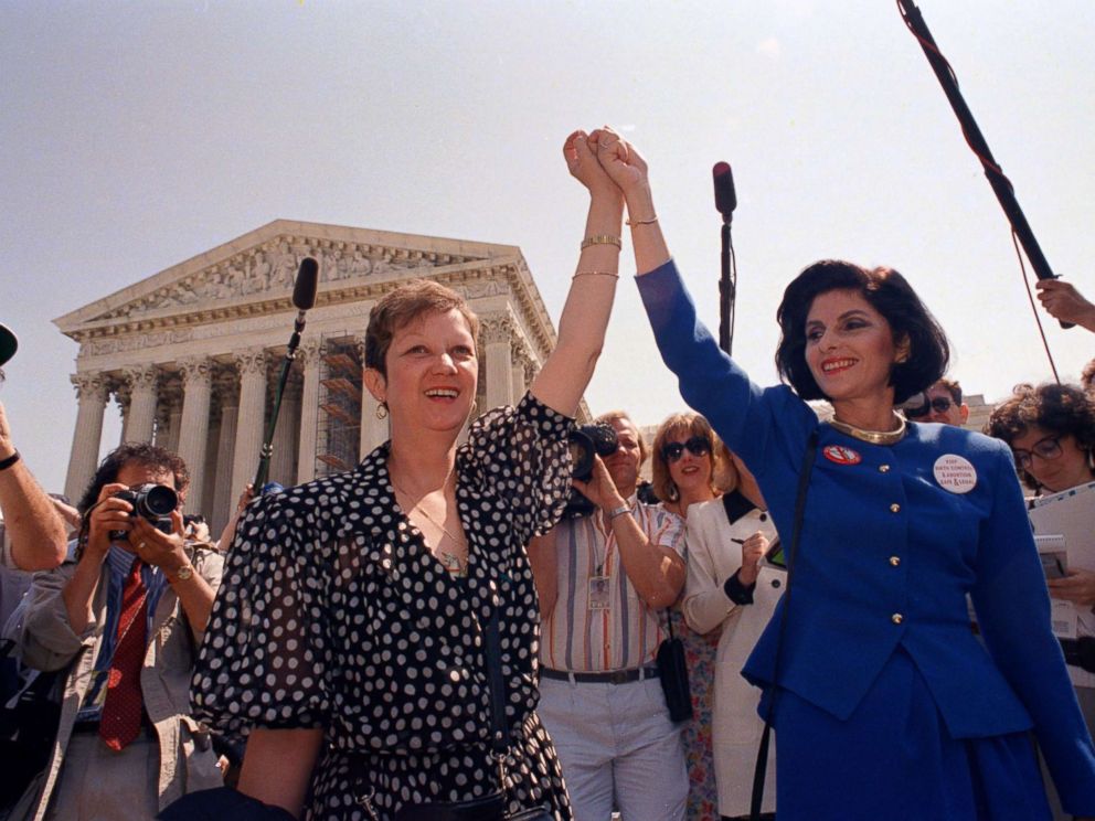 PHOTO: In this Wednesday, April 26, 1989 file photo, Norma McCorvey, Jane Roe in the 1973 court case, left, and her attorney Gloria Allred hold hands as they leave the Supreme Court building in Washington.