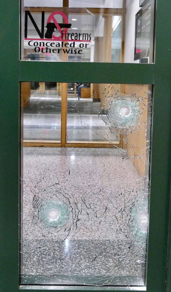 PHOTO: Bullet holes are shown near the door to the entrance of the Charlotte-Mecklenburg Police headquarters in Charlotte, N.C., Jan. 12, 2018. 