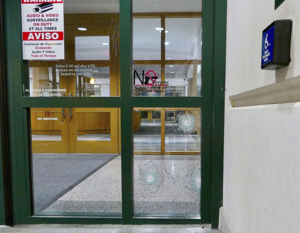 PHOTO: Bullet holes are shown near the door to the entrance of the Charlotte-Mecklenburg Police headquarters in Charlotte, N.C., Jan. 12, 2018. 