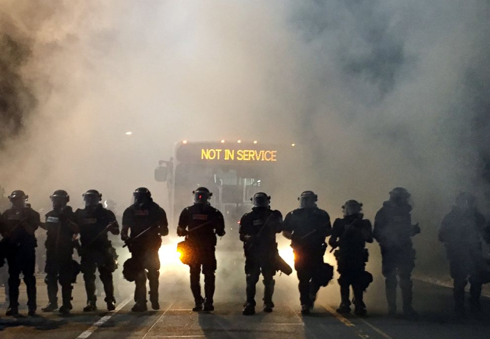 PHOTO: Police officers wearing riot gear block a road during protests after police fatally shot Keith Lamont Scott in the parking lot of an apartment complex in Charlotte, N.C., Sept. 20, 2016.