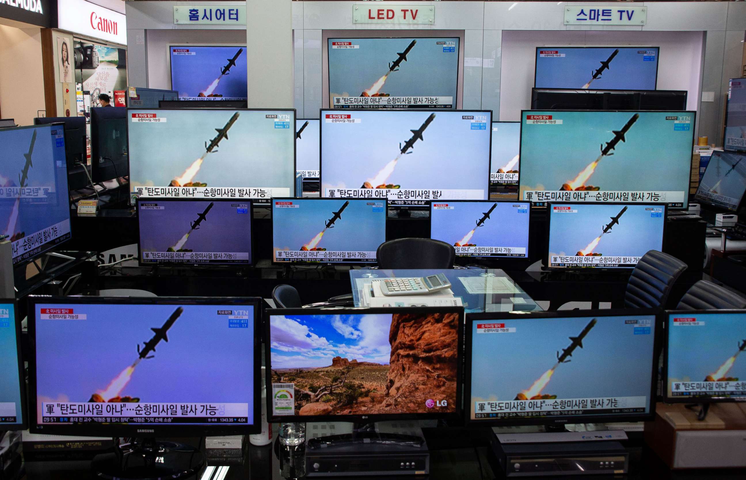 PHOTO: TV screens show news broadcasts at the Yongsan electronics market in Seoul, March 24, 2021.