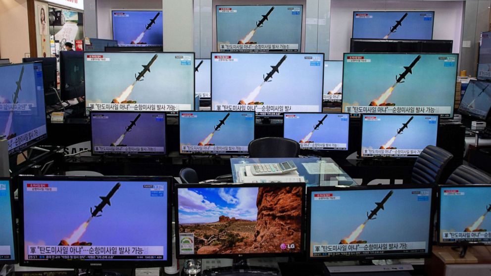 PHOTO: TV screens show news broadcasts at the Yongsan electronics market in Seoul, March 24, 2021.