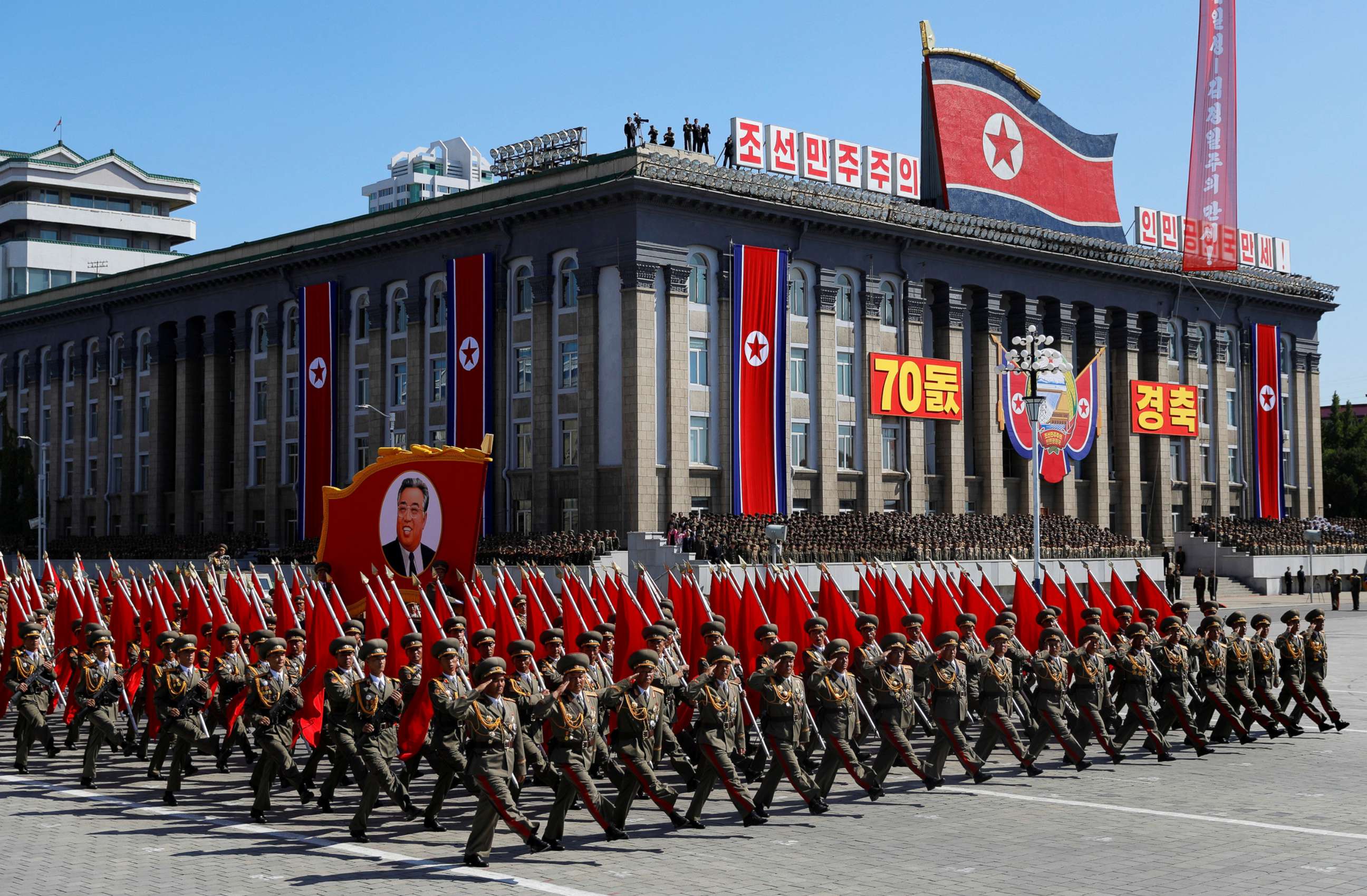 PHOTO: Soldiers march with the portrait of North Korean founder Kim Il Sung during a military parade marking the 70th anniversary of country's foundation in Pyongyang, North Korea, Sept. 9, 2018.