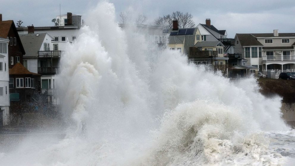 A large wave crashes into a seawall in Winthrop, Mass., March 3, 2018, a day after a nor'easter pounded the Atlantic coast.