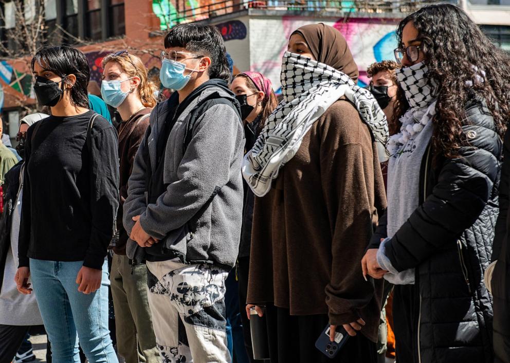 PHOTO: Pro-Palestinian protesters demonstrate in front of a police barricade after police raided an encampment at Northeastern University, in Boston, on April 27, 2024. 