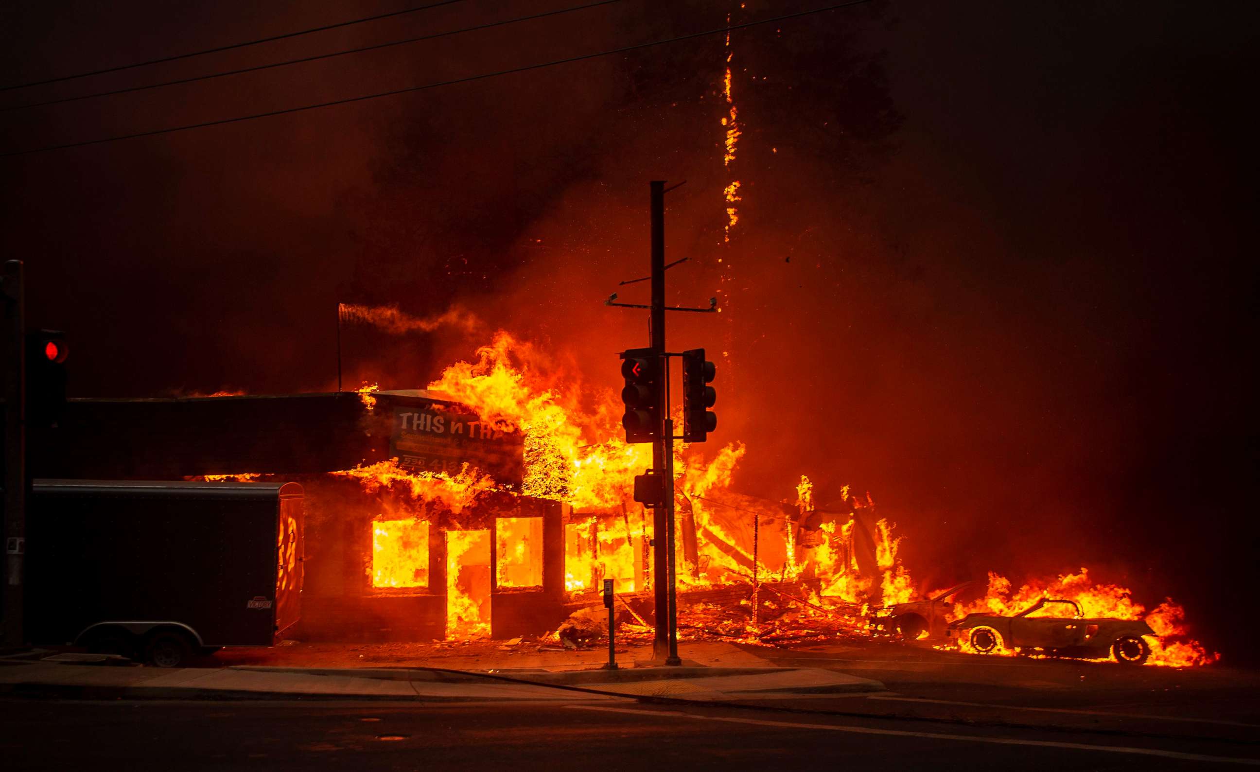 PHOTO: A store burns as the Camp fire tears through Paradise, Calif., Nov. 8, 2018.