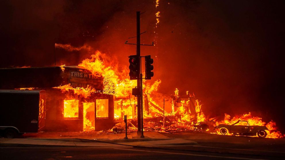  A store burns as the Camp fire tears through Paradise, Calif., Nov. 8, 2018. 