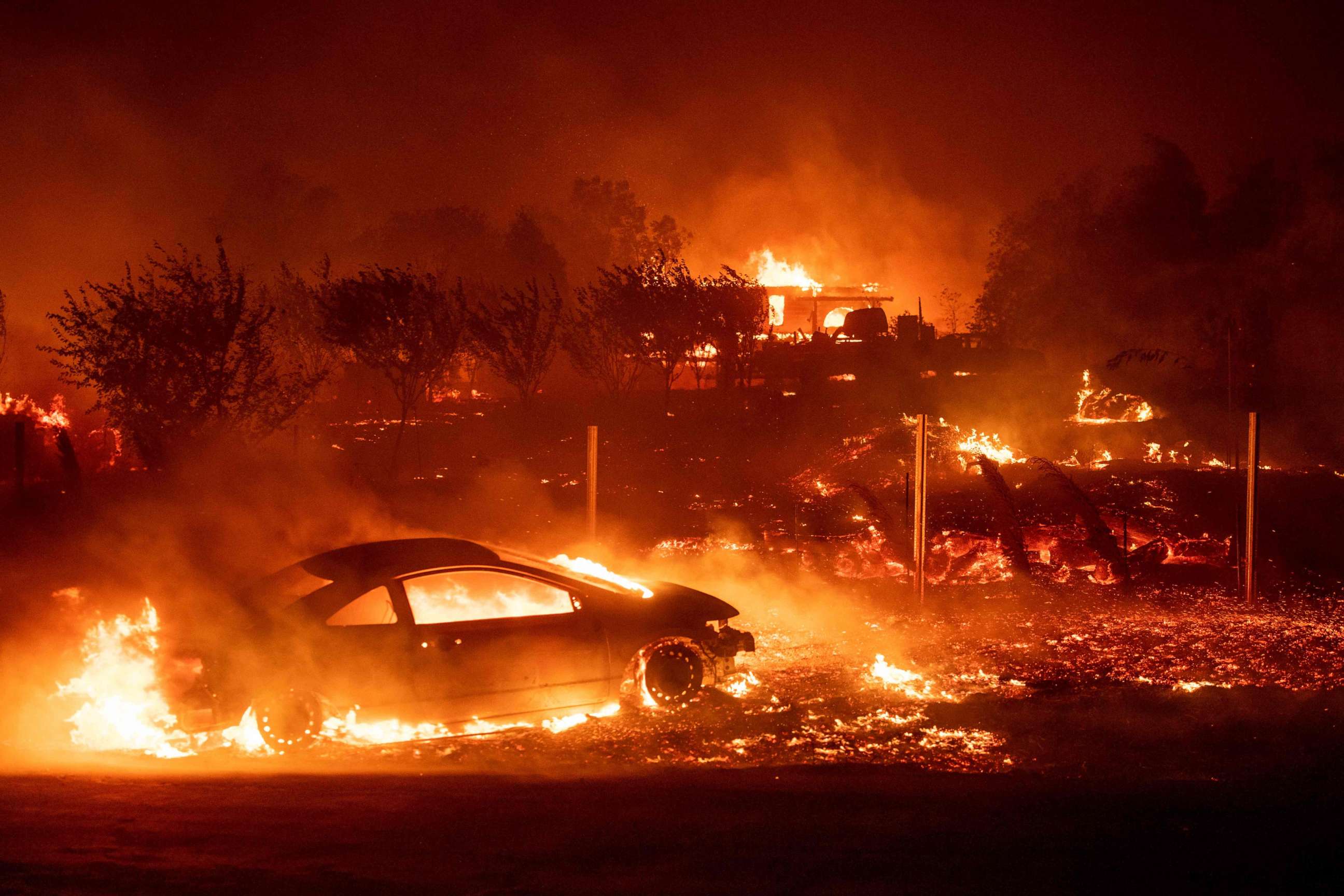 PHOTO: Vehicles and homes burn as the Camp fire tears through Paradise, Calif., on Nov. 8, 2018.