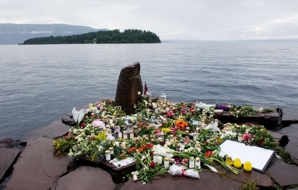 PHOTO: Flowers and candles are left the coast of lake Tyrifjorden infront of the Utoeya island in honor of the victims of the July 22, 2011 shooting spree at a Labour Party youth summer camp on the island of Utoeya.