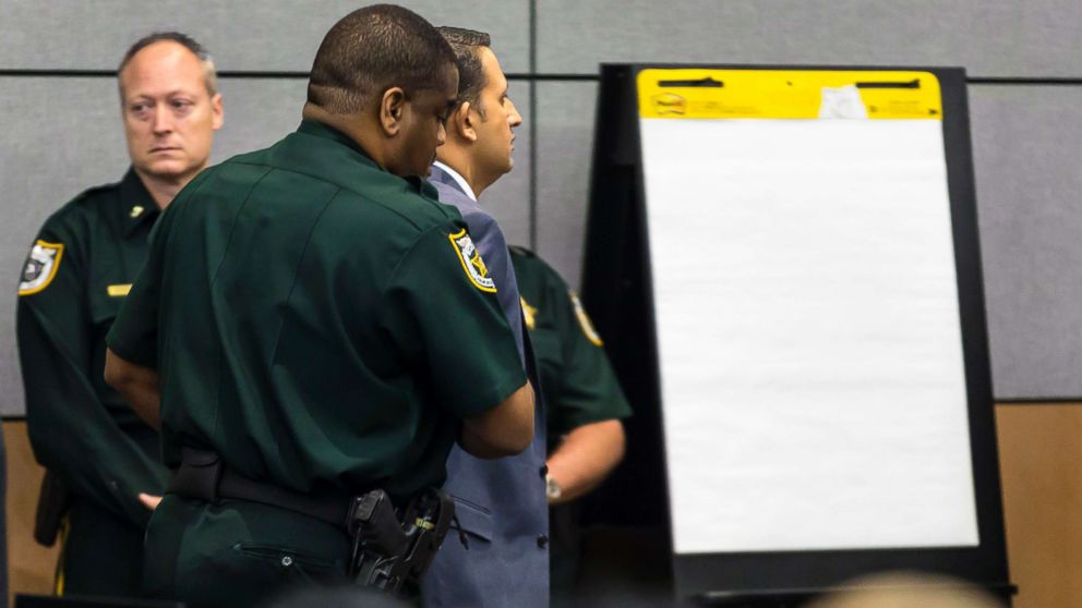 PHOTO: Nouman Raja is led from the courtroom after being taken into custody after being found guilty, March 7, 2019, in West Palm Beach, Fla.