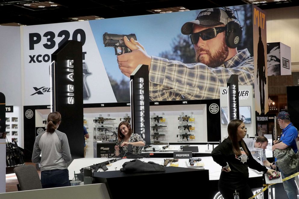 PHOTO: Workers prepare the Sig Sauer display at the 148th NRA Annual Meetings & Exhibits, April 25, 2019, in Indianapolis, Indiana.