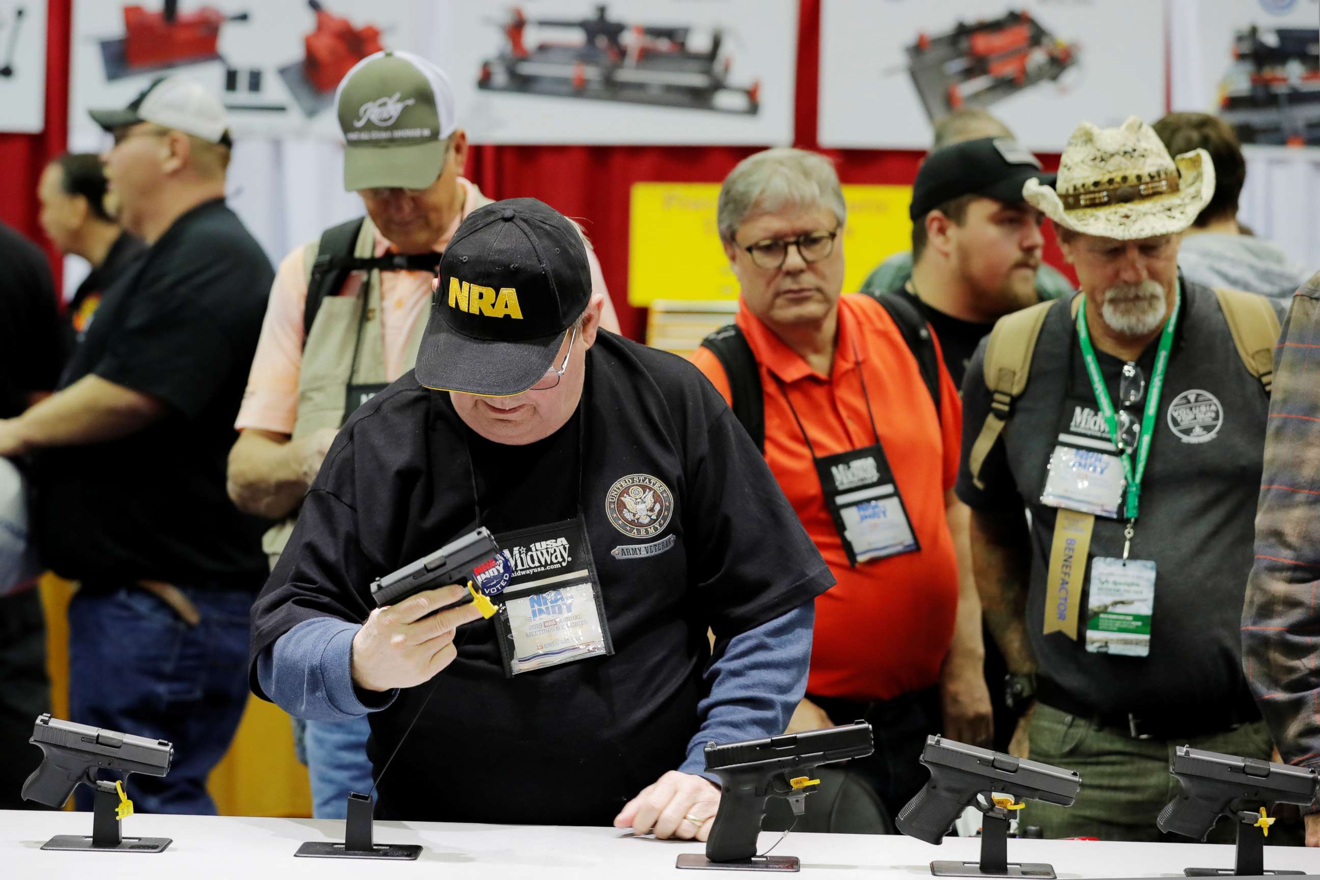 PHOTO: A man handles a Glock handgun during the National Rifle Association (NRA) annual meeting in Indianapolis, Indiana, U.S., April 27, 2019.  REUTERS/Lucas Jackson