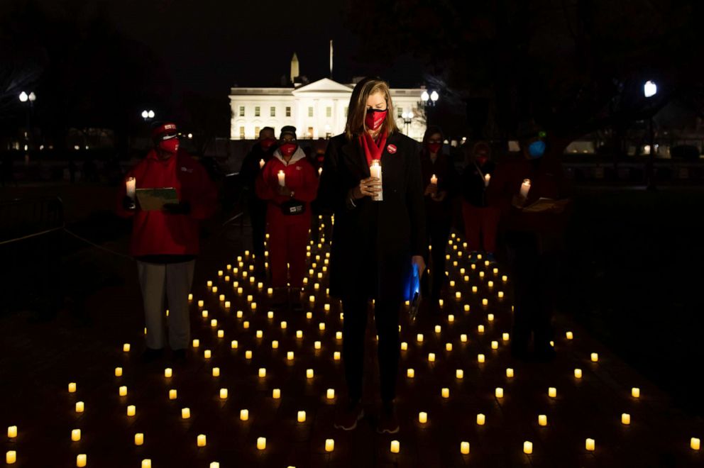 PHOTO: In this Jan. 13, 2022, file photo, National Nurses United hold a candlelight vigil to memorialize and honor all of the nurses who died from Covid-19, in Washington, D.C.