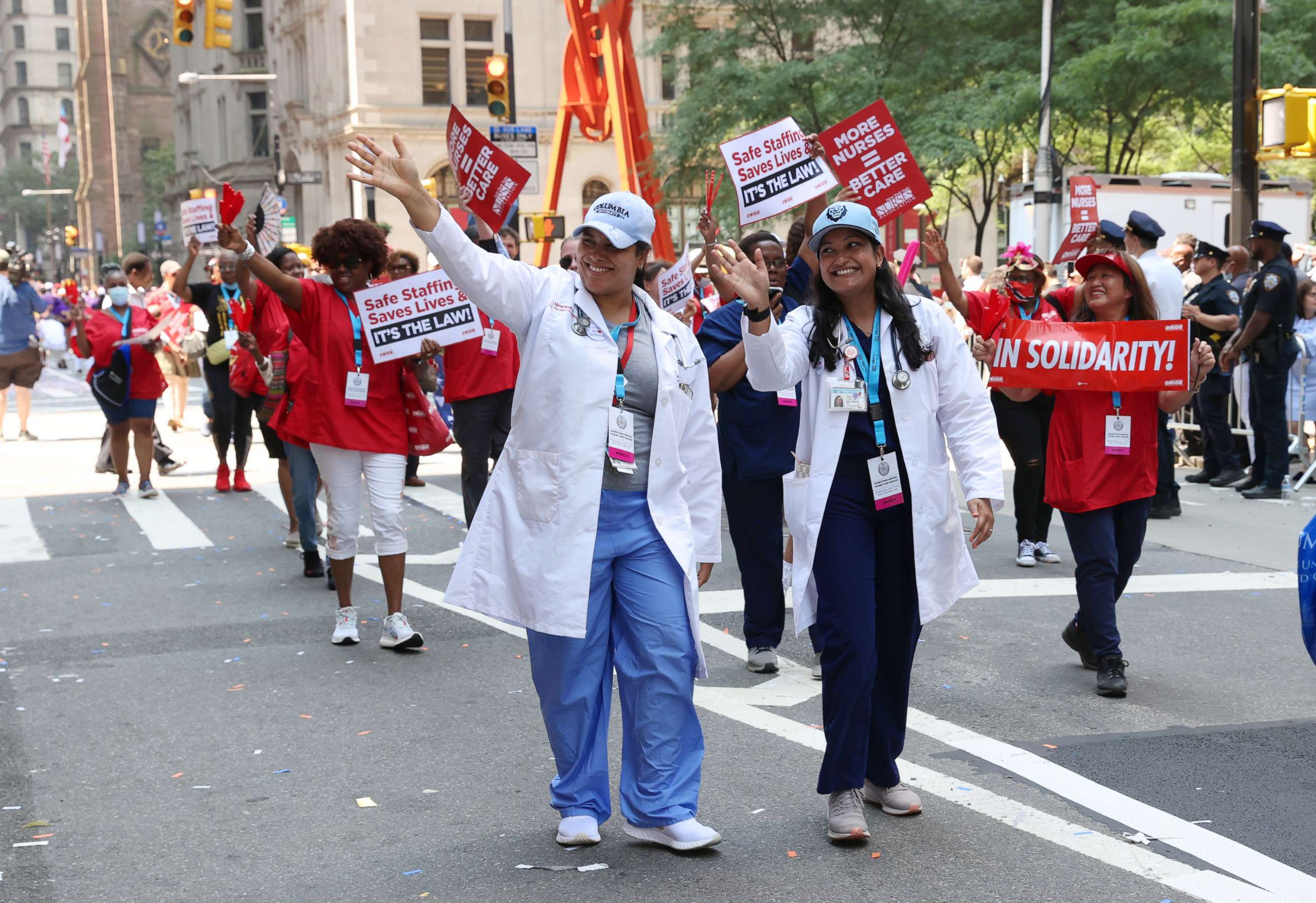 PHOTO: Health Care workers walk during the "Hometown Heroes" ticker tape parade on July 7, 2021, in New York City.