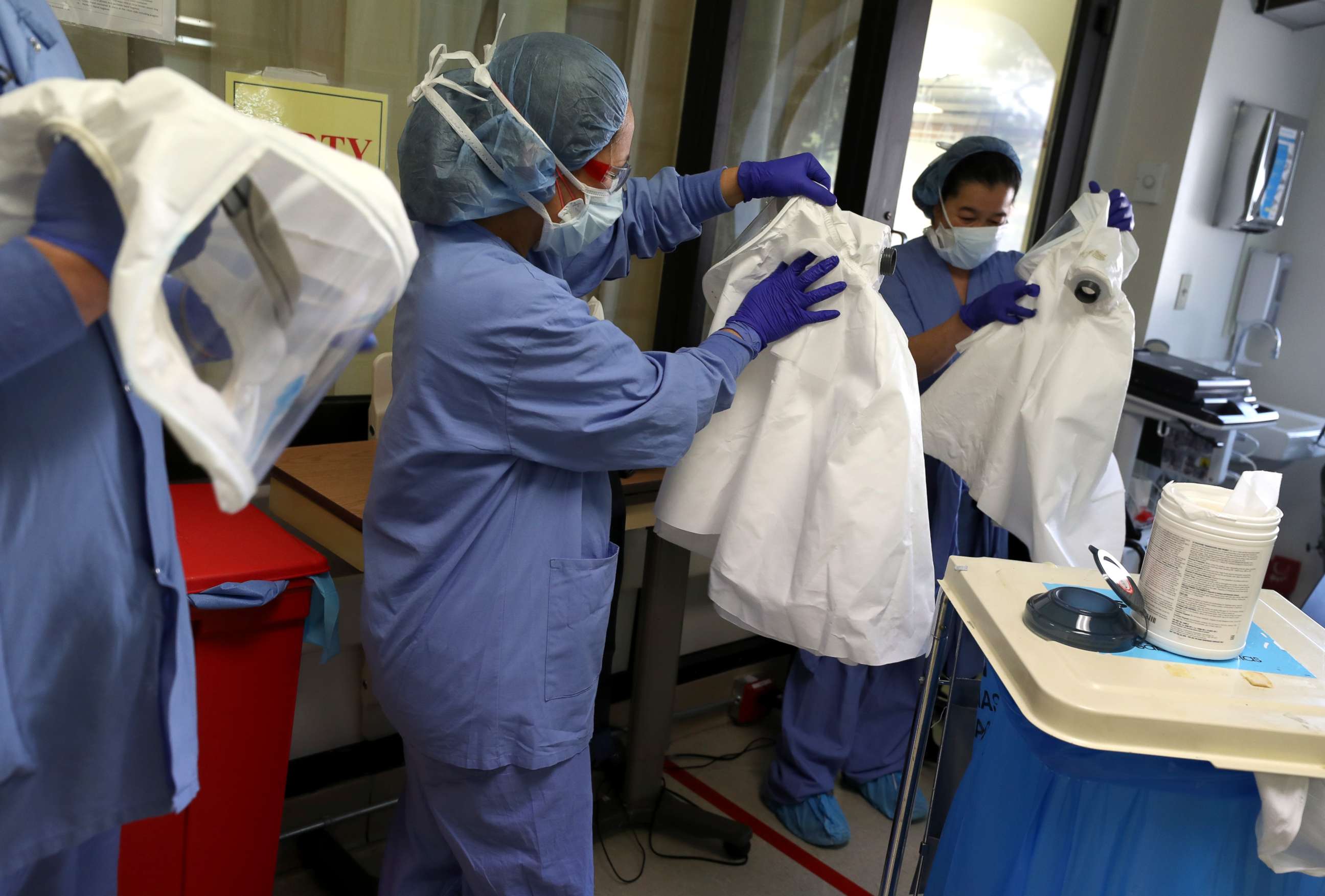 PHOTO: Nurses clean personal protective equipment (PPE) after being part of a team that performed a procedure on a coronavirus COVID-19 patient in the intensive care unit at Regional Medical Center on May 21, 2020 in San Jose, California. 