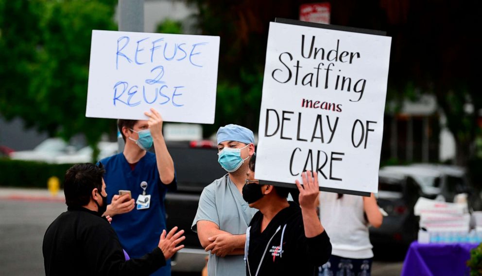 PHOTO: Nurses stage a protest with support from the registered nurses union SEIU Local 121RN outside the West Hills Hospital in West Hills, California, on June 18, 2020.