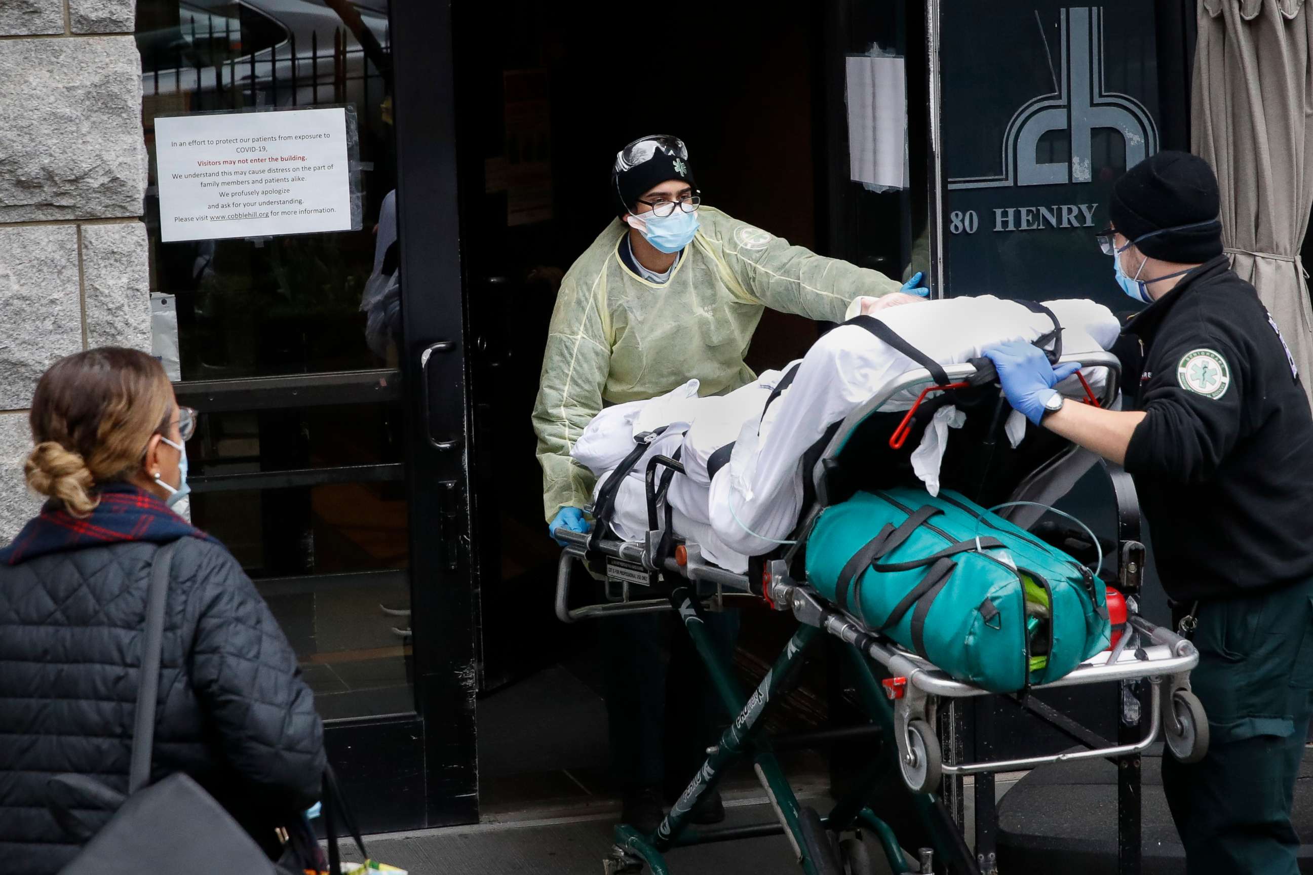 PHOTO: A patient is wheeled into Cobble Hill Health Center by emergency medical workers in the Brooklyn borough of New York, April 17, 2020. 