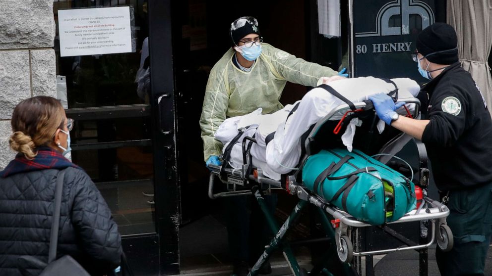 PHOTO: A patient is wheeled into Cobble Hill Health Center by emergency medical workers in the Brooklyn borough of New York, April 17, 2020. 