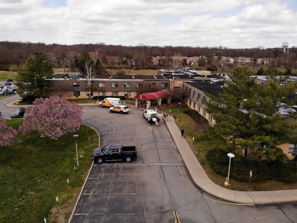 PHOTO: Ambulance crews are parked outside Andover Subacute and Rehabilitation Center in Andover, N.J., on Thursday April 16, 2020.
