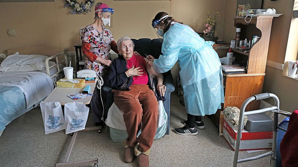 PHOTO: Resident Mary Perkins, gets her COVID-19 vaccine at Life Care of Acton, a skilled nursing and rehab center in Acton, Mass., Dec. 28, 2020.