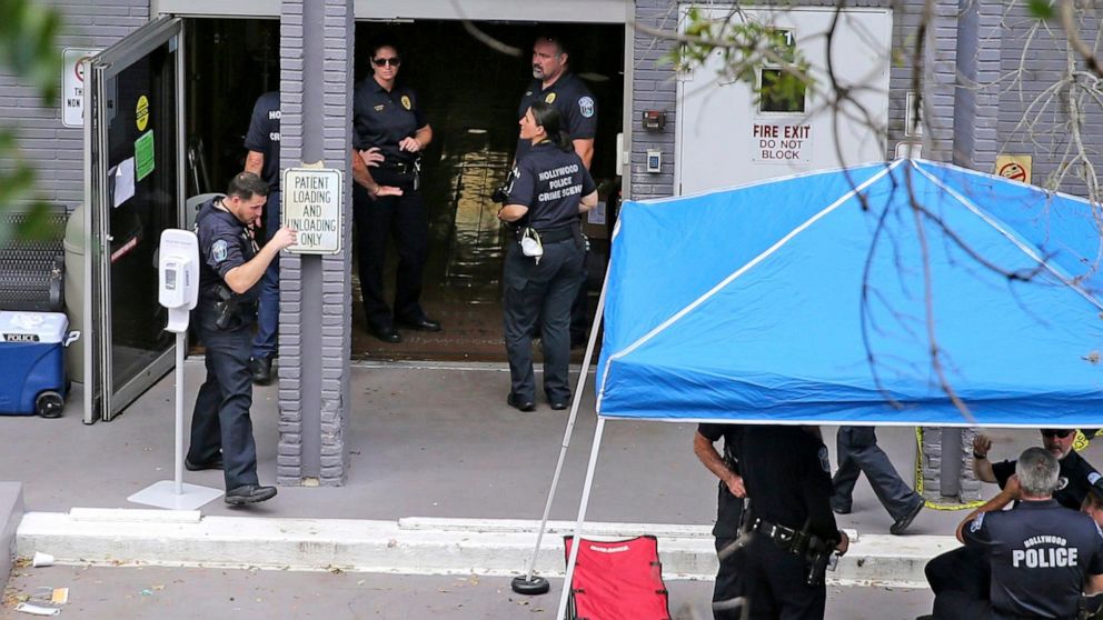 A Sept. 13, 2017 file photo shows a police staging area at the south entrance of the Rehabilitation Center at Hollywood Hills where residents died, in Hollywood, Fla.
