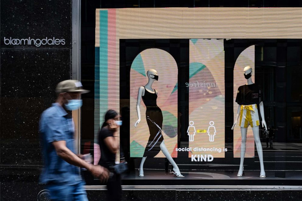 PHOTO: Mannequins wearing protective masks are displayed in a window at a Bloomingdale's Inc. store in New York, on Monday, June 22, 2020.