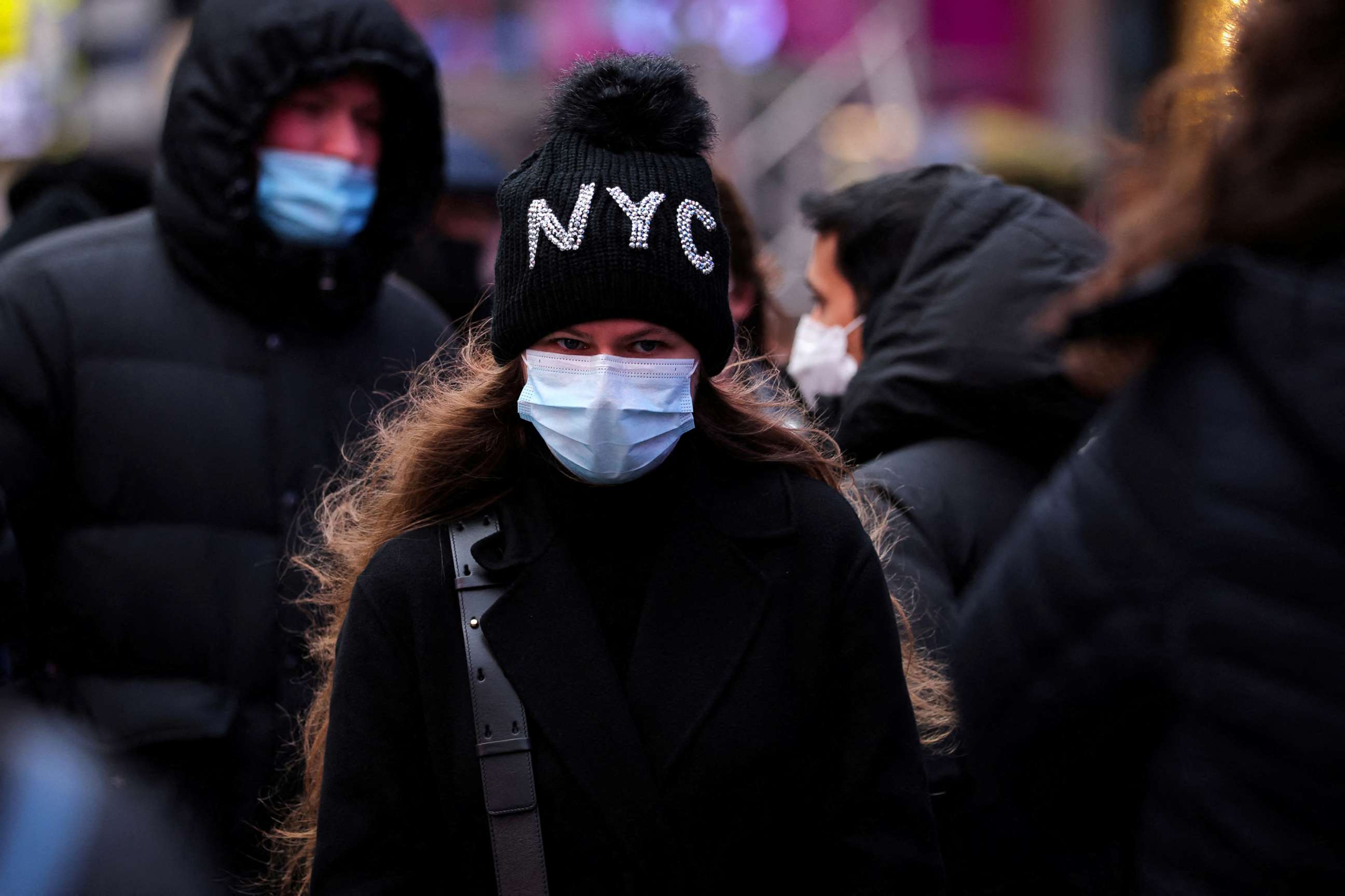 PHOTO: A person waits in a queue for a COVID-19 test in Times Square during cold weather in New York City, Dec. 19, 2021.