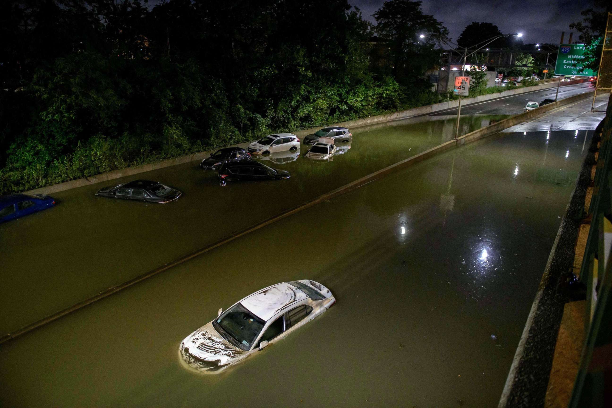 PHOTO: Floodwater surrounds vehicles following heavy rain on an expressway in Brooklyn, N.Y., Sept. 2, 2021.