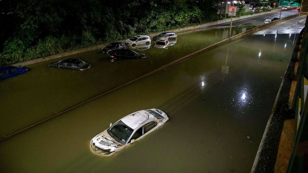 PHOTO: Floodwater surrounds vehicles following heavy rain on an expressway in Brooklyn, N.Y., Sept. 2, 2021.