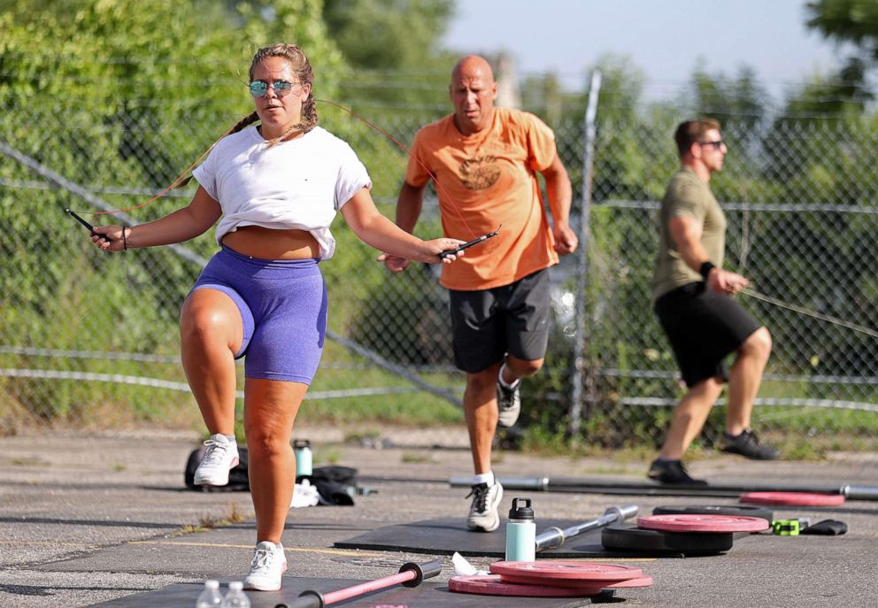 PHOTO: Taylor Wroblewski and her Dad Frank jump rope during an outdoor Jetty Gym "Outside The Box" fitness workout, July 20, 2020, in Oceanside, New York.
