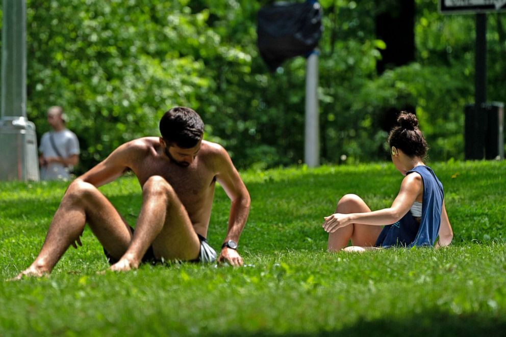 PHOTO: People sun bathe in Central Park on May 22, 2022 in New York City, with temperatures rising  in the metro area in the upcoming days, prompting heat advisories across the region.