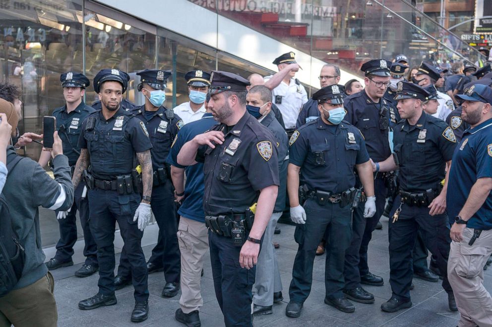 PHOTO: NYPD officers work to restore order in Times Square, New York on May 20, 2021, as violence erupts during Pro-Israel and Pro-Palestinians protests in connection with the conflict in the Gaza Strip.