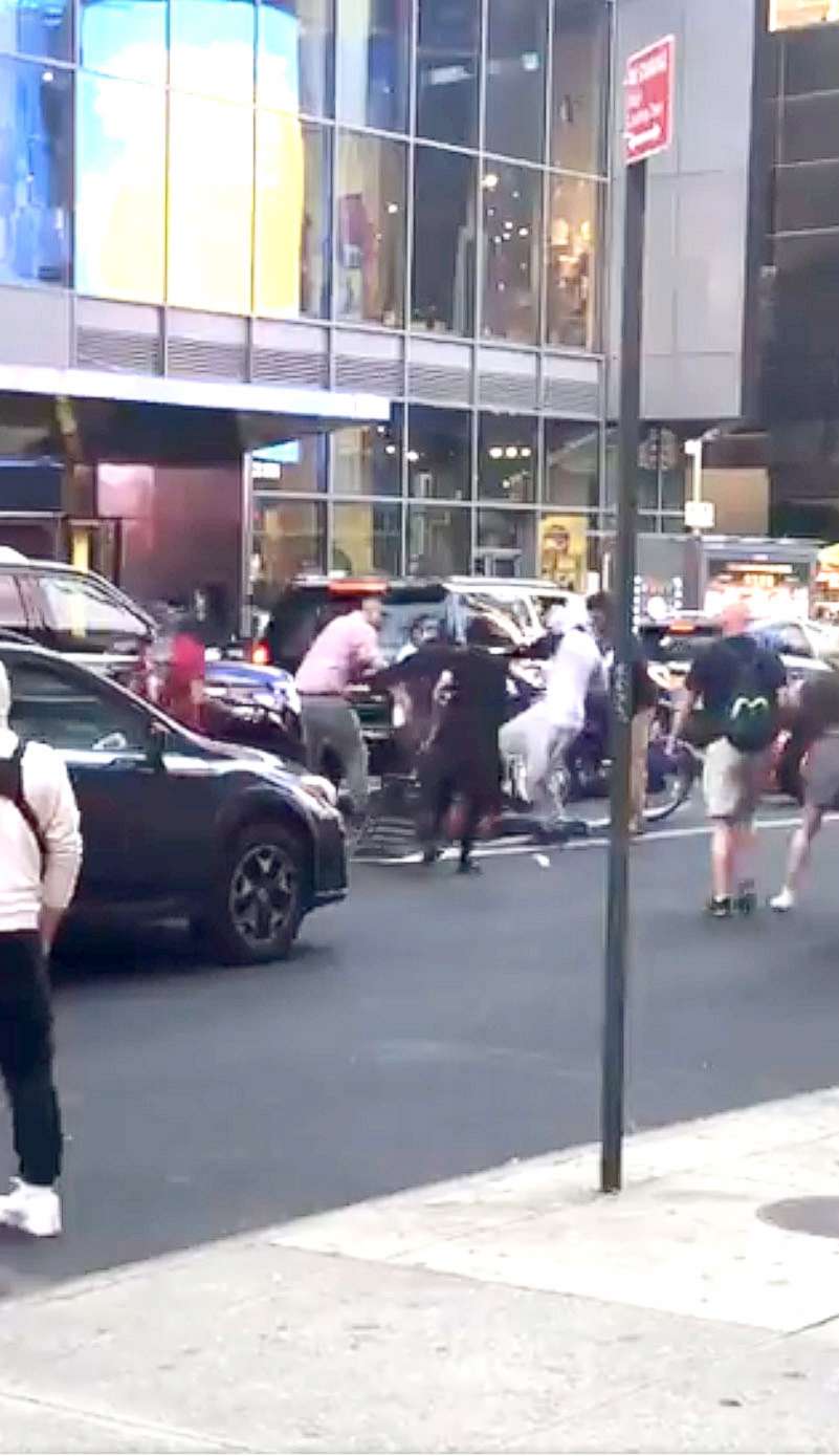 PHOTO: A group of people are seen as a Jewish man is assaulted amid pro-Israel and pro-Palestine protests in Times Square, New York, on May 20, 2021, in an image taken from video made on the scene and posted to Twitter by a witness.