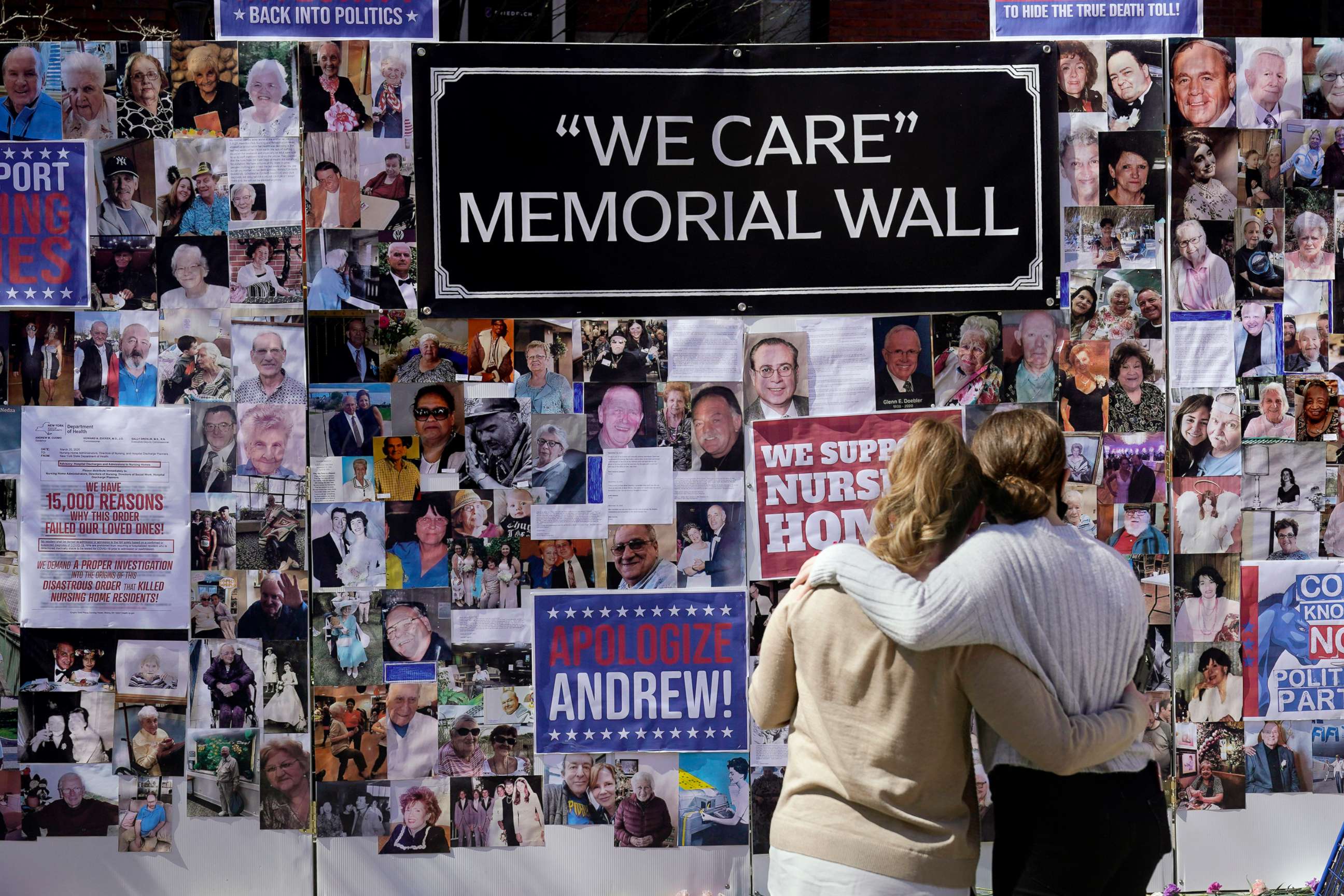 PHOTO: Theresa Sari, left, and her daughter Leila Ali look at a section of a memorial wall after a news conference in New York, March 21, 2021.