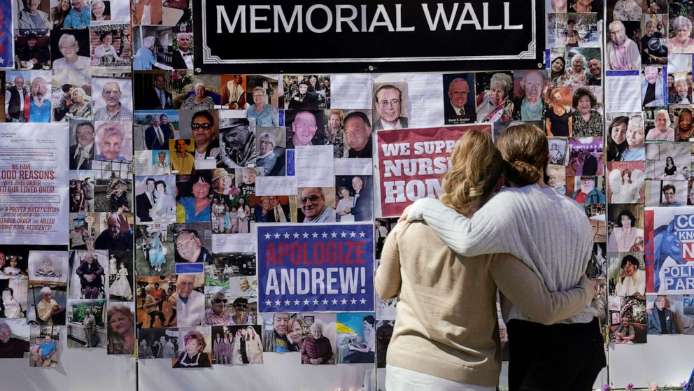 PHOTO: Theresa Sari, left, and her daughter Leila Ali look at a section of a memorial wall after a news conference in New York, March 21, 2021.