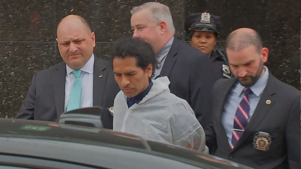 PHOTO: A man identied as David Bonola is led by police officer after his arrest for the murder of Orsolya Gaal, on April 21, 2022 in New York City. Gaal was found dead in Kew Gardens, Queens in New York, on April 16, 2022.
