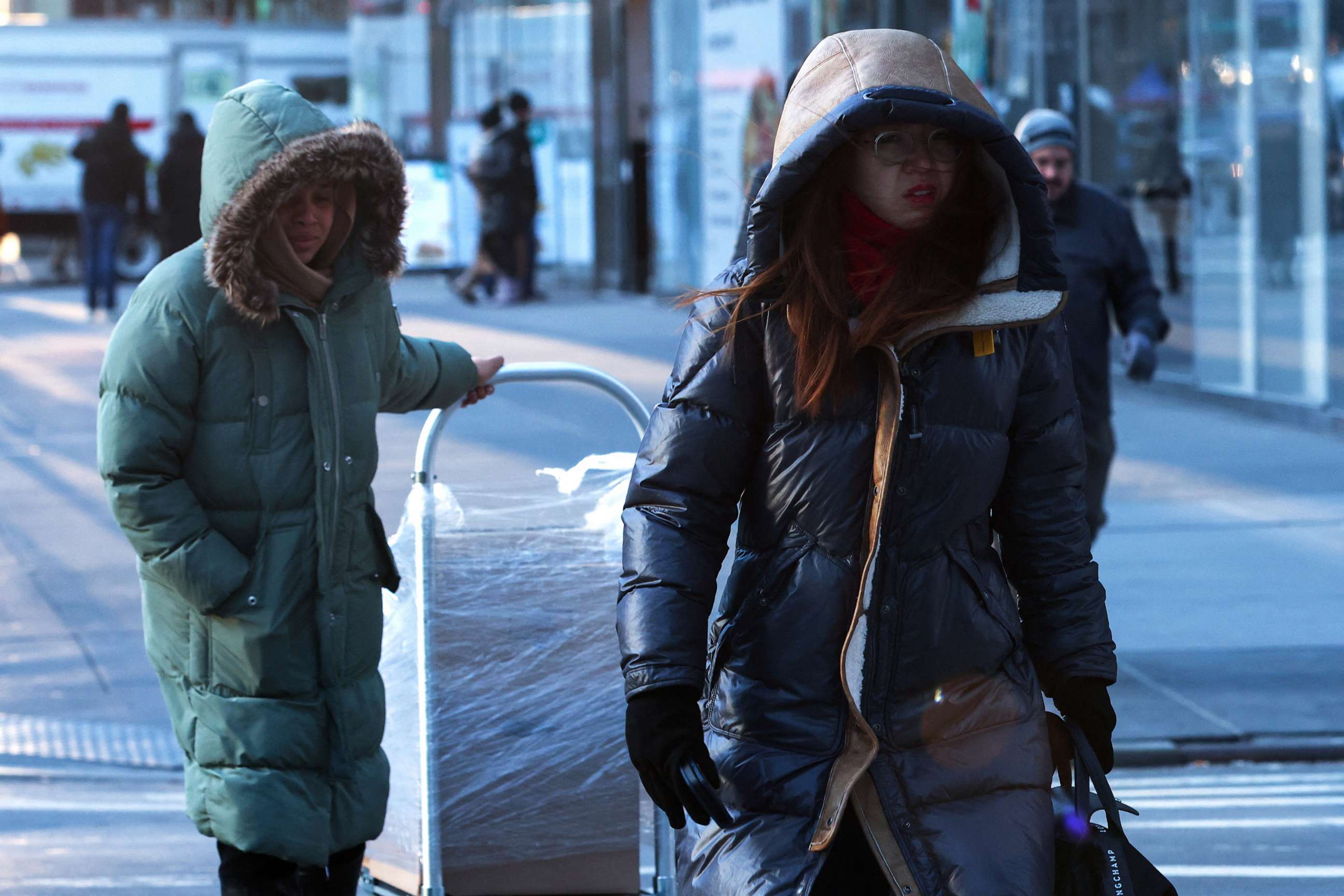 PHOTO: People bundled up walk in midtown Manhattan as bitter cold temperatures moved into much of the northeast United States in New York City, Feb. 3, 2023.