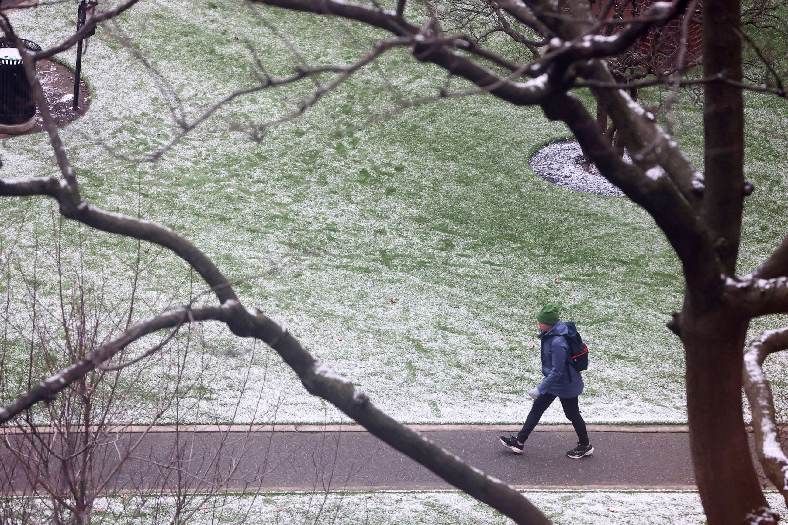 PHOTO: A person walks through a park following the first measurable snowfall of the season, breaking a 50 year record, in New York City, Feb. 01, 2023.