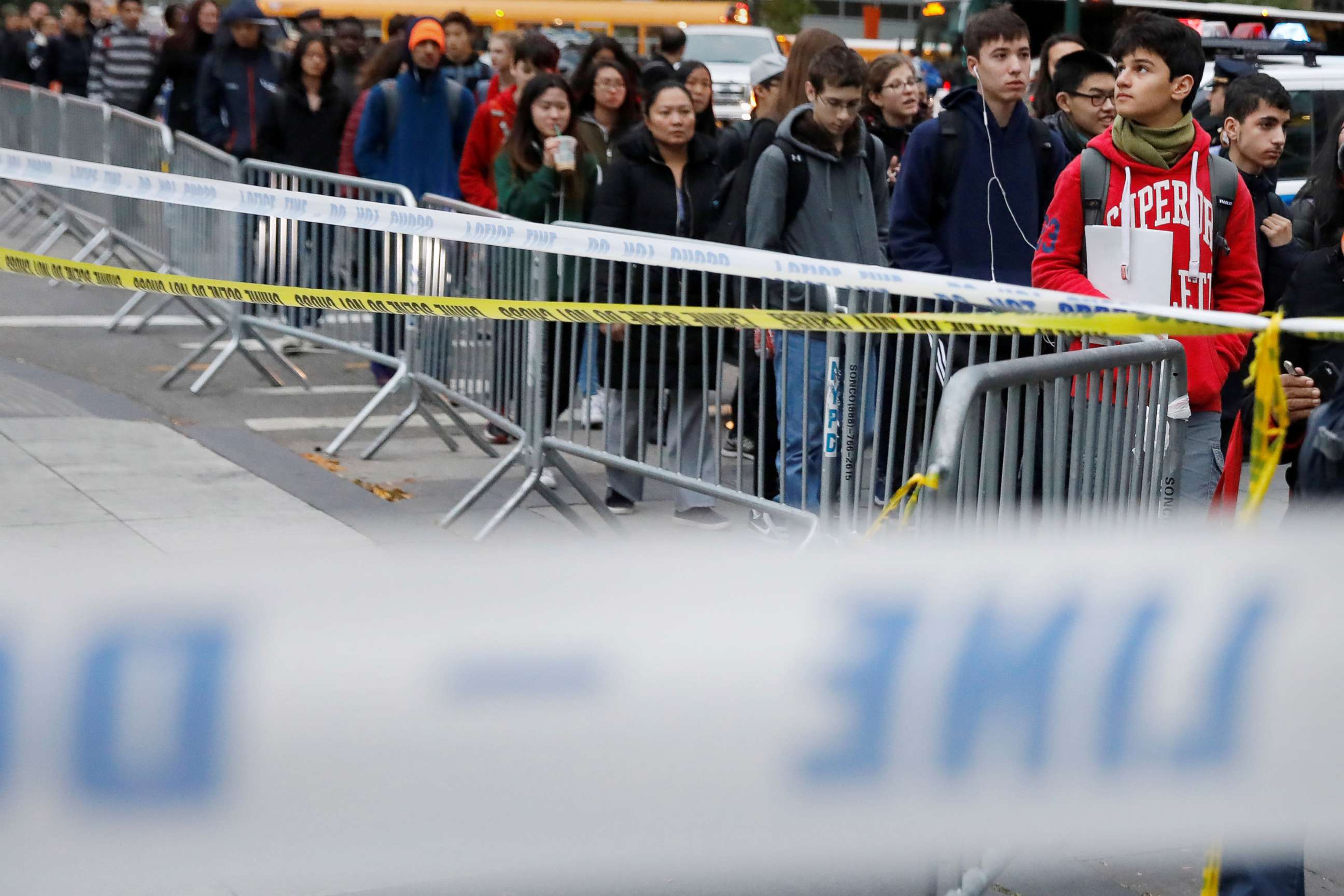 PHOTO: Students walk past police line tape on their way to school a day after a man driving a rented pickup truck mowed down pedestrians and cyclists on a bike path alongside the Hudson River in New York City, Nov. 1, 2017. 